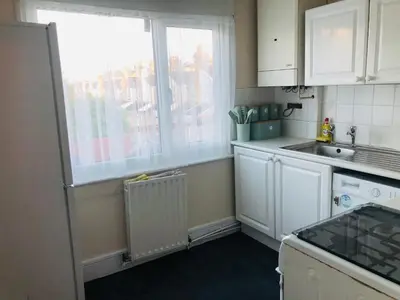 a small kitchen with a sink and a window at AC Lounge 119a in Rochford