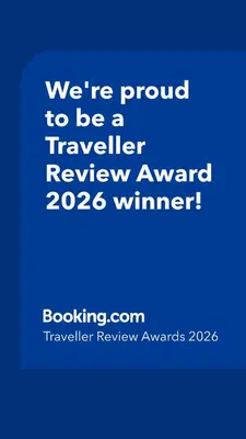 a blue sign that says were proud to be a traveller reviewagency winner at The Little Barn in Hoxne