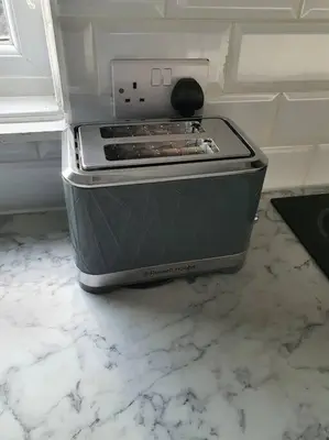 a stove sitting on a counter in a kitchen at Awave From It All - Escape the city life in Jaywick Sands