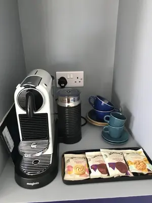 a kitchen counter with a coffee maker and a toaster at Willow Barn luxury countryside accommodation in Bury St Edmunds in Bury Saint Edmunds