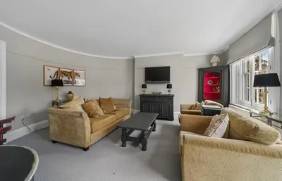 a living room with two couches and a table at 119 Flat 2 Northgate st - Stylish one bedroom apartment set within walking distance to town, spacious living space with public car park close by in Bury Saint Edmunds