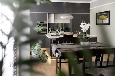 a kitchen and dining room with a dining room table at Stylish Central Apartment with Parking & Lift in Bury Saint Edmunds