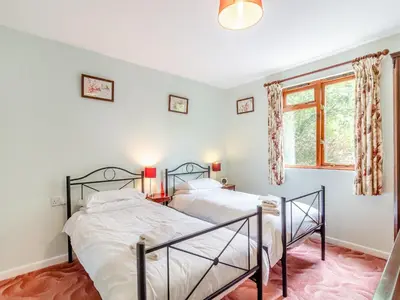 two beds in a bedroom with a window at Bryanstown Annexe in Woodbridge