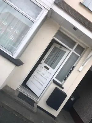 a front door of a house with a white door at Ac lounge36 Room B in Rochford