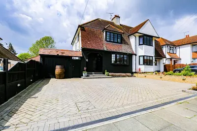 a house with a brick driveway in front of it at Cosy Studio flat near hospital - Pass the Keys in Westcliff On Sea