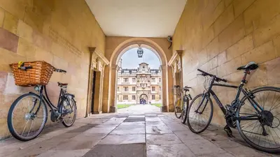 two bikes parked on the wall of a building at Luxury Apartment with king-size Bed in Central Cambridge - easy walk to Station and City Centre in Cambridge