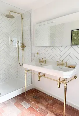 a white bathroom with a sink and a shower at The Pear Tree Inn in Bury Saint Edmunds