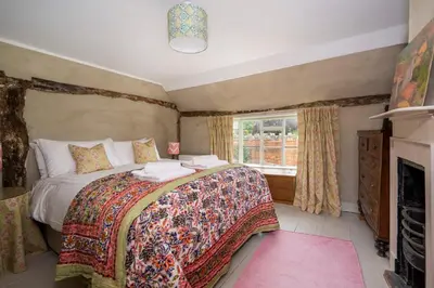 a bedroom with a large bed and a window at Pats Place in Sudbury