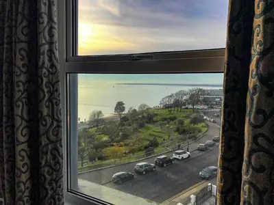 a window with a view of a street with cars at Muthu Westcliff Hotel (Near London Southend Airport) in Southend-on-Sea