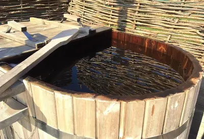 a wooden pool of water in a wooden tub at Lushna 2 Petite at Lee Wick Farm Cottages & Glamping in Clacton-on-Sea