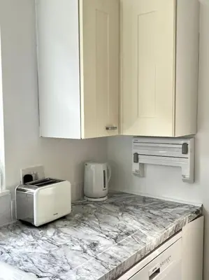 a kitchen with a counter top with a toaster and a toaster at Spacious 4 bedroom house in Billericay