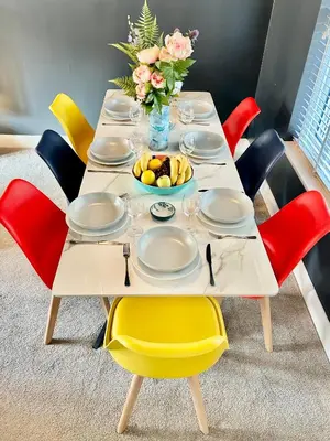 a table with plates and a bowl of fruit on it at 5 Bedroom House - DISC0UNTS - Parking, Contractors, Group, Family in Braintree