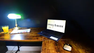 a laptop computer sitting on top of a wooden desk at 5 Bedroom House - DISC0UNTS - Parking, Contractors, Group, Family in Braintree