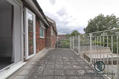 a porch with a gate next to a building at Purple Velvet - 2 Bed Home Spacious - Basildon Essex Upto 5 Guests, Free Wifi , Free Parking in Basildon