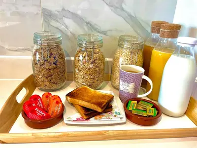 a tray with jars of breakfast foods and drinks at The Top Floor in Stretham