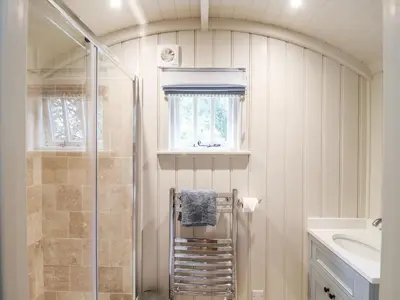 a bathroom with a shower and a sink at Utopia in Harleston