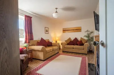 a living room with two chairs and a couch at Escape in Aldeburgh