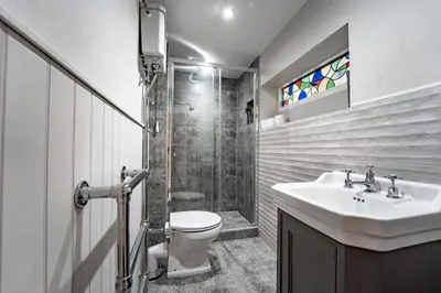 a bathroom with a sink and a toilet and a shower at 5 Bed Farmhouse Suitable for Contractors Private Parking in Potter Street