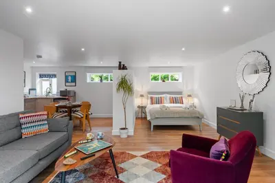 a living room with a couch and a table at Attractive 2 storey, 2 bedroom barn in Long Melford in Long Melford