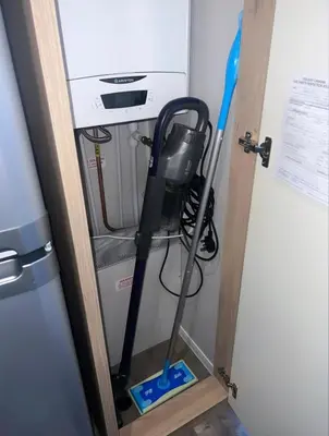 a mop in the corner of a room at Brand New Modern Holiday Home - Haven The Orchards Holiday Park in Saint Osyth