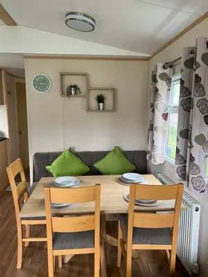 a dining room with a table and chairs at Lovely place in Saint Osyth