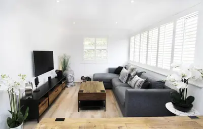 a living room with a couch and a table at Modern and Cosy Flat For 4 in Cherry Hinton