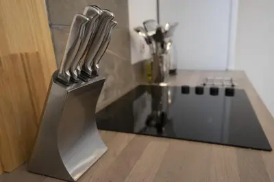 a knife block sitting on top of a kitchen counter at The Den - KING BED, 5 min walk to City Centre in Cambridge