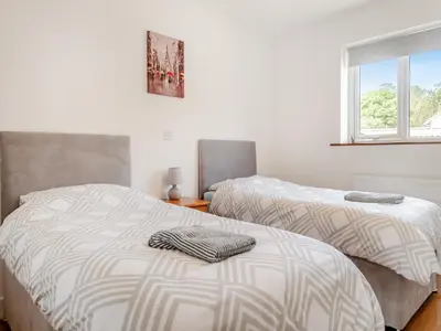 two beds sitting next to each other in a bedroom at Chestnut Lodge in Old Buckenham
