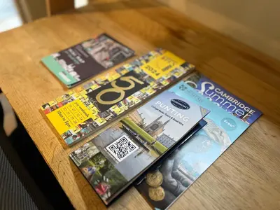 a table with magazines on top of it at Modern, Gr Floor 1 bed, bathroom, garden & private entry with Free Parking in Cambridge
