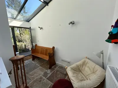 a living room with a couch and a window at Beautiful Victorian house in central Cambridge in Cambridge