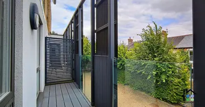 an open door on a house with a fence at R&O Property Experts - Riverside - 2 & 3 BR - Flat Walk to Centre with open Parking in Cambridge