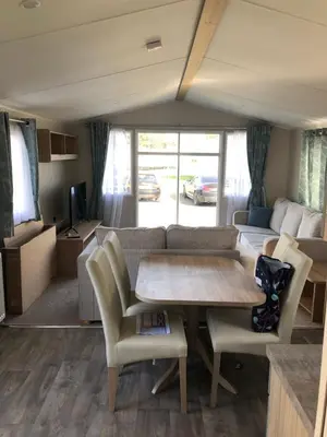 a living room with a table and a couch at Beach house fun in Walton-on-the-Naze