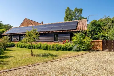 a house with solar panels on the roof at 1 Bed in Saxmundham oc-c27420 in Farnham