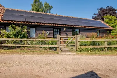 a house with solar panels on the roof at 1 Bed in Saxmundham oc-c27420 in Farnham