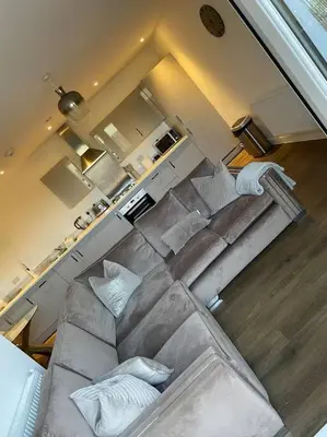 an overhead view of a living room with a couch at Spacious Apartment in the Heart of Chelmsford in Chelmsford
