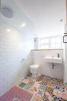 a bathroom with a toilet and a sink at Lilac Cottage, Wenhaston in Halesworth