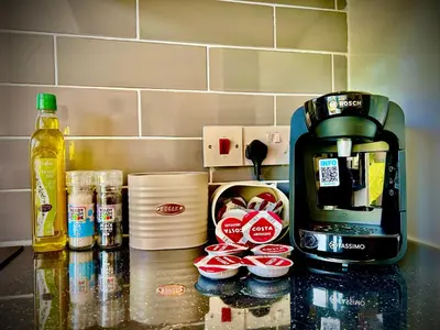 a counter top with a coffee maker and some food at 6 Bedroom House - DISC0UNTS - Pool Table, Parking, Contractors, Group, Family in Colchester
