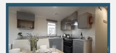 a kitchen with a sink and a stove top oven at Ultimate serene getaway in East Mersea