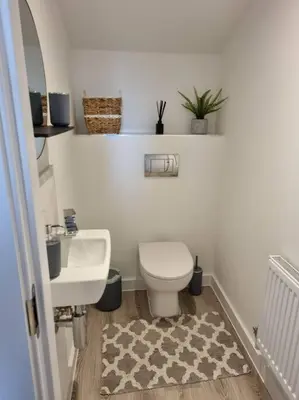 a bathroom with a white toilet and a sink at Modern 2bedroom House in Ipswich Suffolk in Ipswich