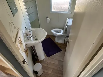 a bathroom with a sink and a toilet at Holiday Caravan in Clacton-on-Sea