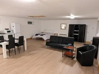 a living room with a couch and a table at The Annex in Felixstowe