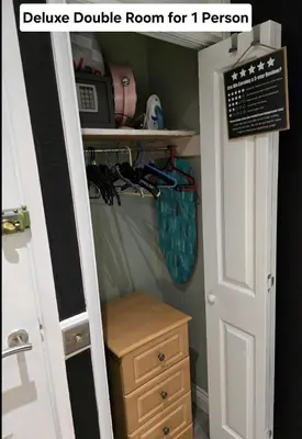 a room with a closet with a door and a drawer at Luxury on a Budget Chelmsford - B&B ROOM in a quiet family home in Chelmsford