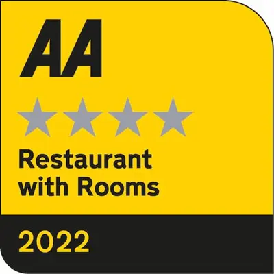 a yellow sign with stars and a requirement with rooms at The Blue Anchor Feering in Colchester