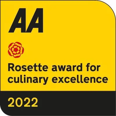 a yellow sign with aaa residue award for culinary excellence at The Blue Anchor Feering in Colchester