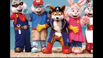 a group of cartoon mascots posing for a picture at PET FREE family mobile Home sleeps 8 with large secured decking Sea wick holiday park in Clacton-on-Sea