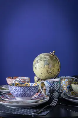 a group of cups and saucers on a table at Jade Apartments Basildon in Basildon