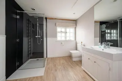a bathroom with a sink and a shower and a toilet at Dragonfly Cottage, Long Melford in Long Melford