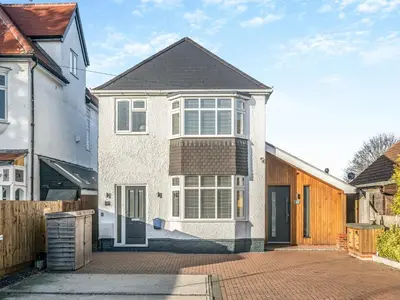 a large white house with a brick driveway at Coastal Gem in Clacton-on-Sea