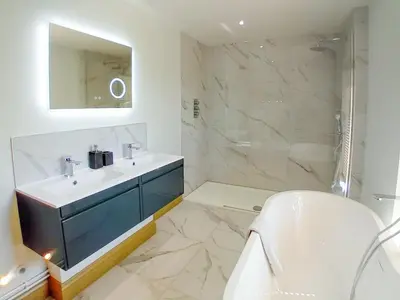 a white bathroom with a sink and a shower at 3 Bed in Ipswich oc-80545 in Stowmarket