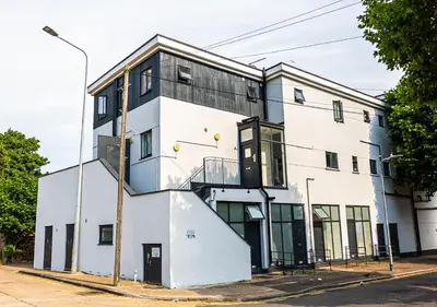 a white building on a city street at Stylish & Modern Apartment - Southend Stays in Southend-on-Sea